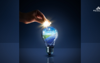 A hand is holding a light bulb with the earth inside.